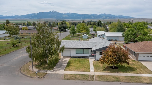 birds eye view of property with a mountain view