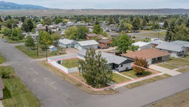 birds eye view of property featuring a mountain view