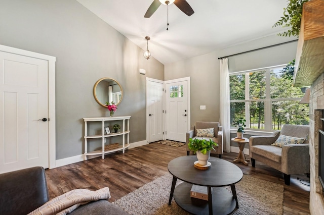 interior space with high vaulted ceiling, dark wood-type flooring, and ceiling fan