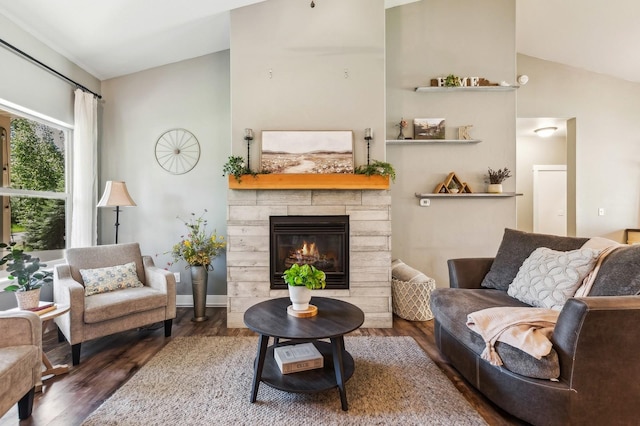 living room with lofted ceiling, a fireplace, and dark hardwood / wood-style flooring