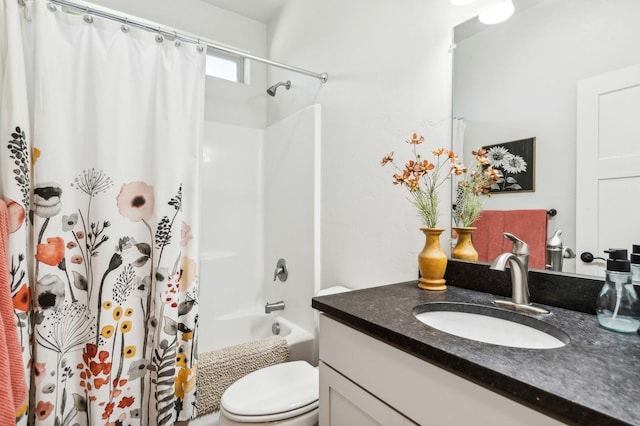 full bathroom featuring vanity, shower / tub combo, and toilet