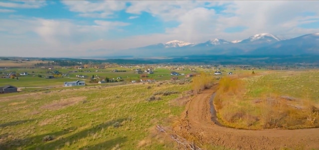 bird's eye view featuring a mountain view and a rural view