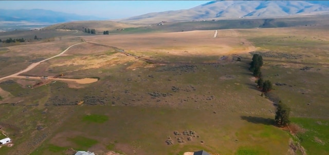 bird's eye view featuring a mountain view and a rural view