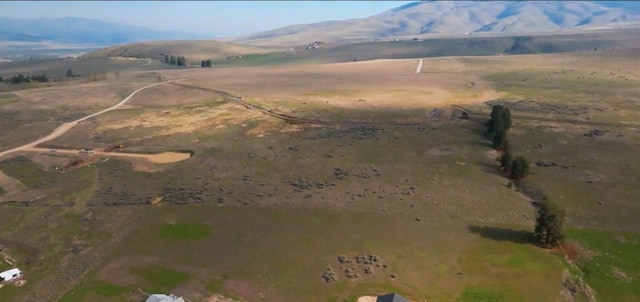 birds eye view of property with a rural view and a mountain view