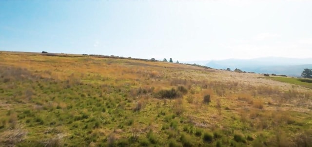 view of local wilderness featuring a mountain view and a rural view