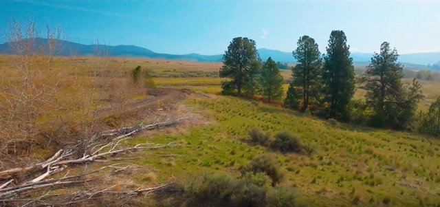 mountain view featuring a rural view