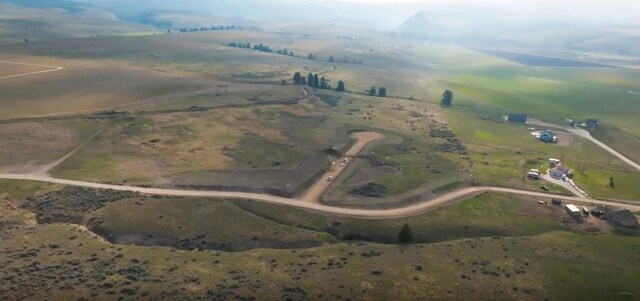 birds eye view of property with a rural view