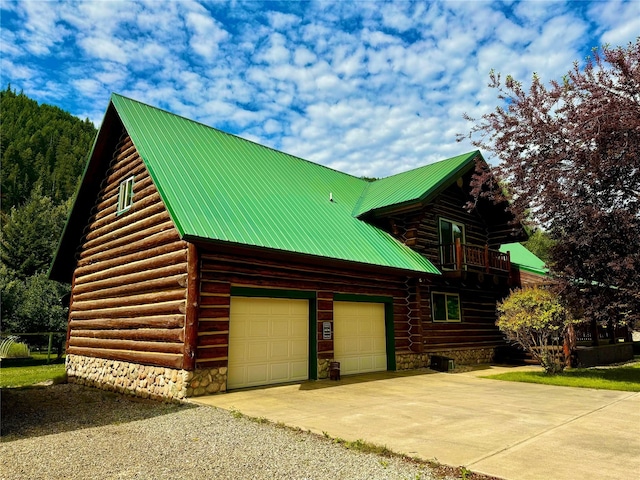 view of side of home featuring a garage