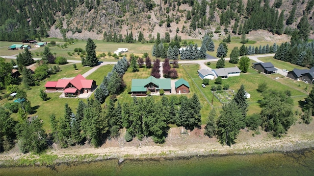 birds eye view of property with a water view and a rural view