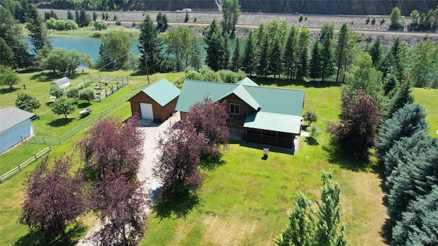 birds eye view of property with a water view