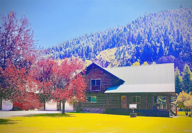 log home with central AC unit and a front lawn