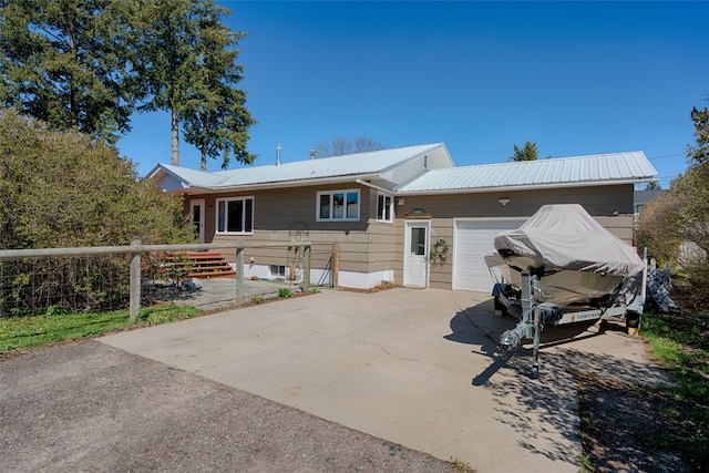 back of property with a garage