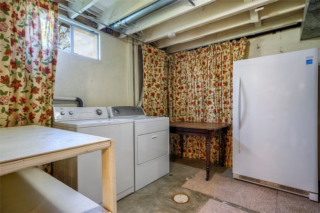 washroom with washing machine and dryer