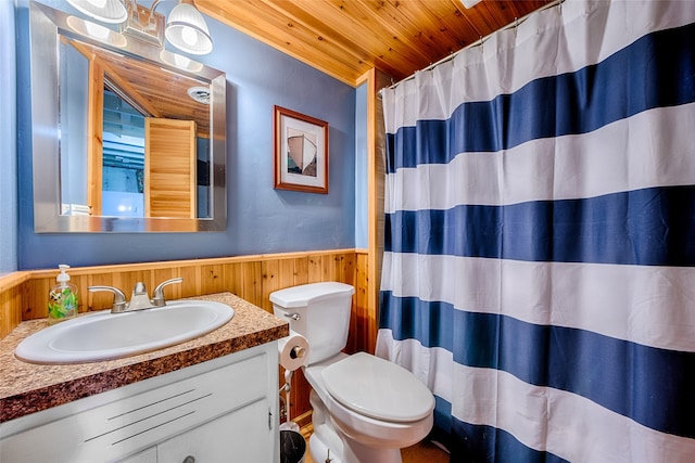 bathroom featuring toilet, wood walls, wooden ceiling, a shower with curtain, and vanity