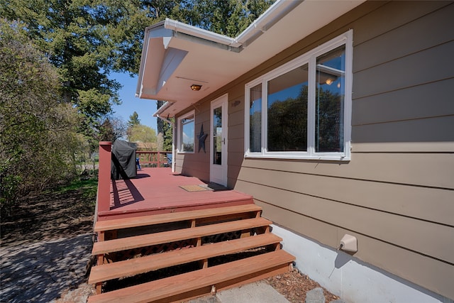 wooden deck with area for grilling