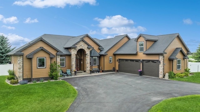 view of front of home featuring a garage and a front yard