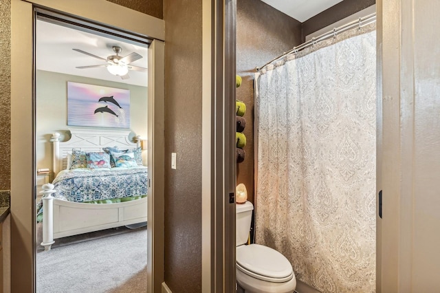 282 Mcwenneger Dr, Kalispell, MT 59901 - full bathroom with a textured wall, a ceiling fan, and a shower with shower curtain