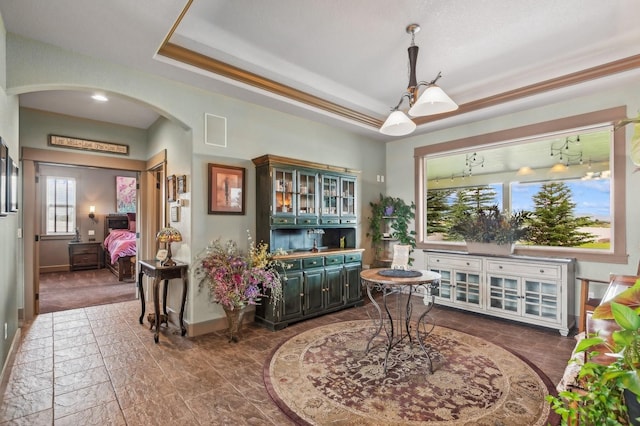 282 Mcwenneger Dr, Kalispell, MT 59901 - living area featuring arched walkways and a tray ceiling