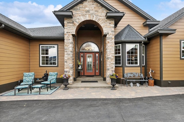 doorway to property with a patio area