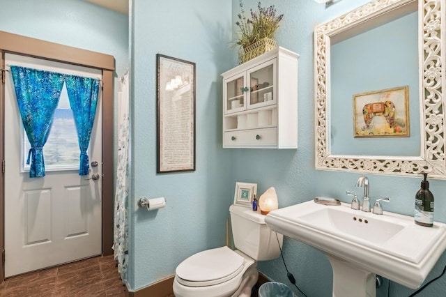 282 Mcwenneger Dr, Kalispell, MT 59901 - full bath with toilet and wood finished floors