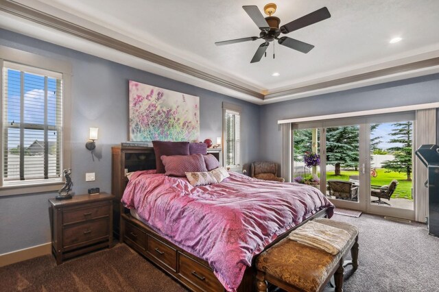 282 Mcwenneger Dr, Kalispell, MT 59901 - carpeted bedroom featuring access to exterior, ceiling fan, recessed lighting, and a tray ceiling