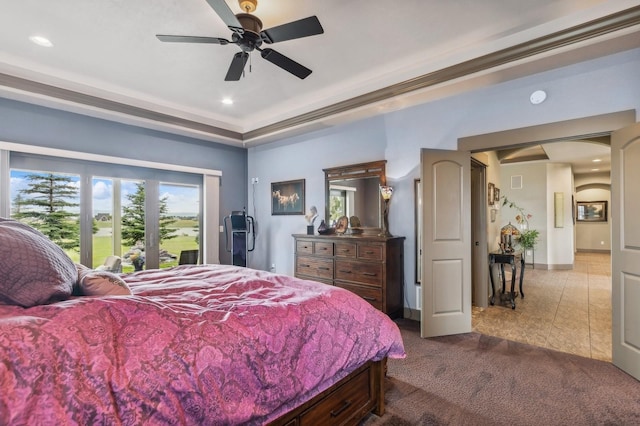 282 Mcwenneger Dr, Kalispell, MT 59901 - bedroom featuring arched walkways, dark colored carpet, recessed lighting, a ceiling fan, and a raised ceiling