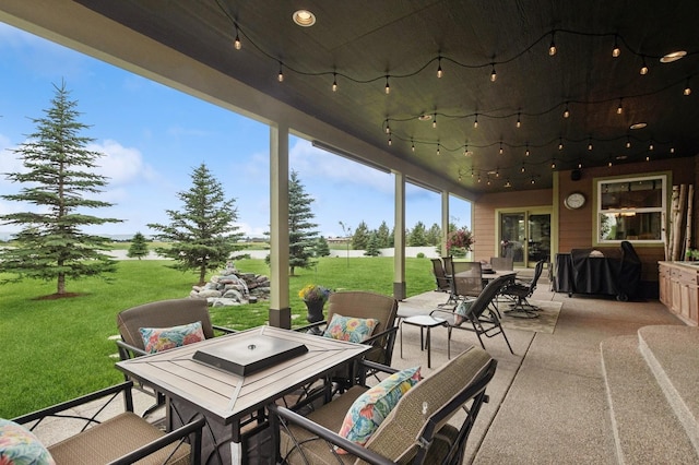 282 Mcwenneger Dr, Kalispell, MT 59901 - view of patio featuring outdoor dining area, a water view, and grilling area