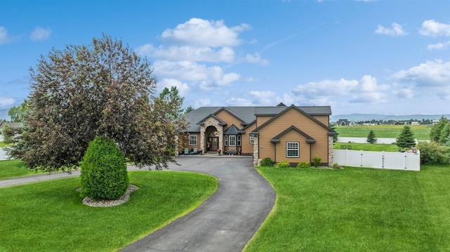 282 Mcwenneger Dr, Kalispell, MT 59901 - view of front of house with a gate and curved driveway