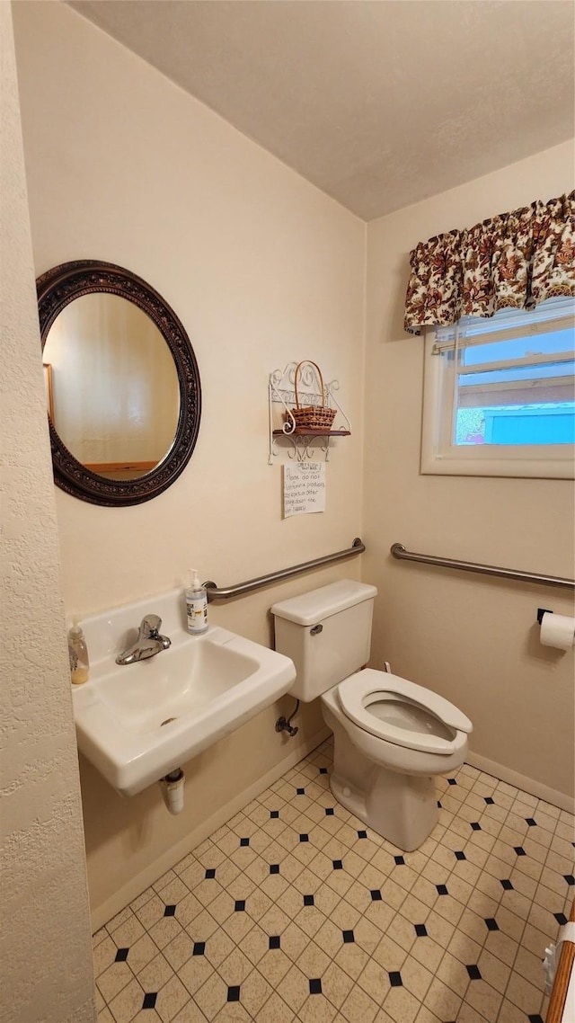 bathroom with toilet and sink