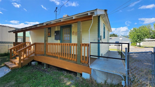 back of house featuring covered porch