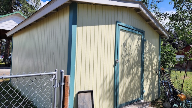 view of side of property featuring a shed