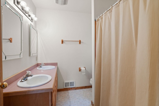 112 Glen View Dr, Eureka, MT 59917 - full bath featuring tile patterned floors, visible vents, and a sink