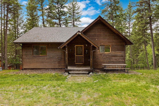 112 Glen View Dr, Eureka, MT 59917 - view of front facade with a front yard and a shingled roof