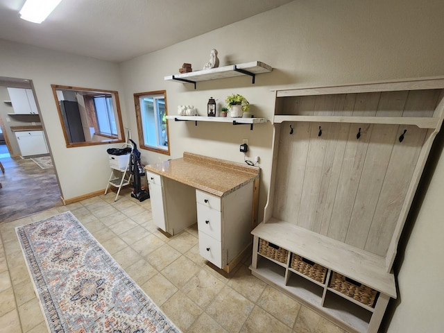 mudroom with light tile patterned floors