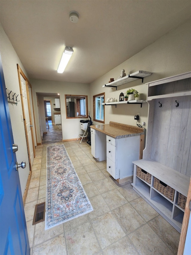 mudroom featuring light tile patterned floors