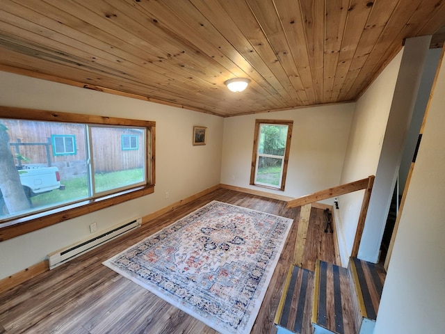 interior space featuring hardwood / wood-style flooring, lofted ceiling, a baseboard heating unit, and wood ceiling