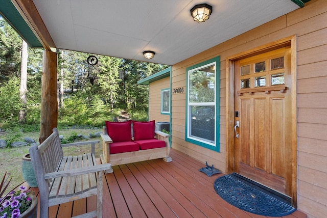 doorway to property featuring covered porch