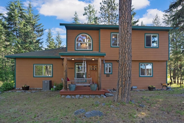 view of front of property with central AC and covered porch