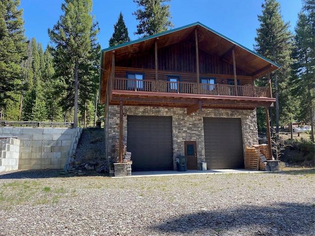 exterior space with a balcony and a garage