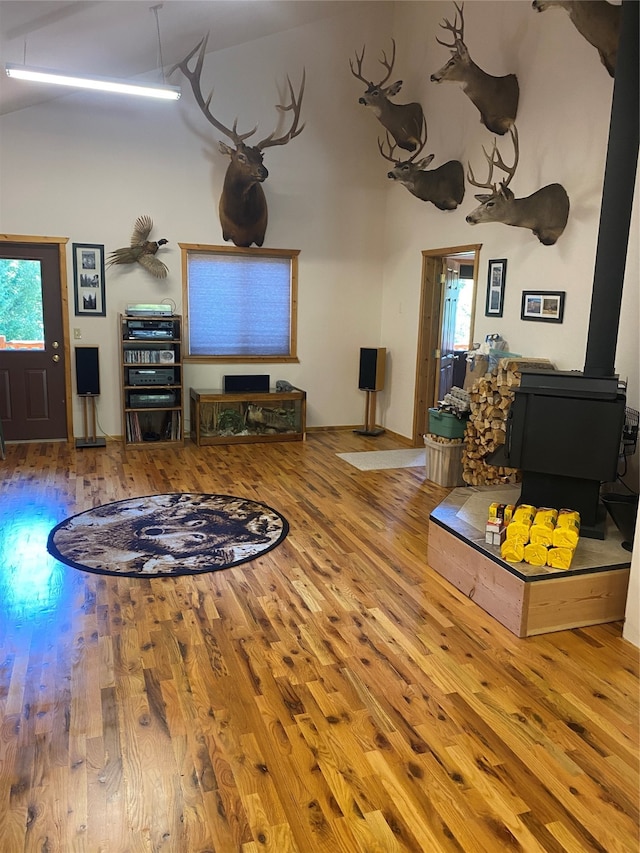 living room featuring a wood stove and hardwood / wood-style floors