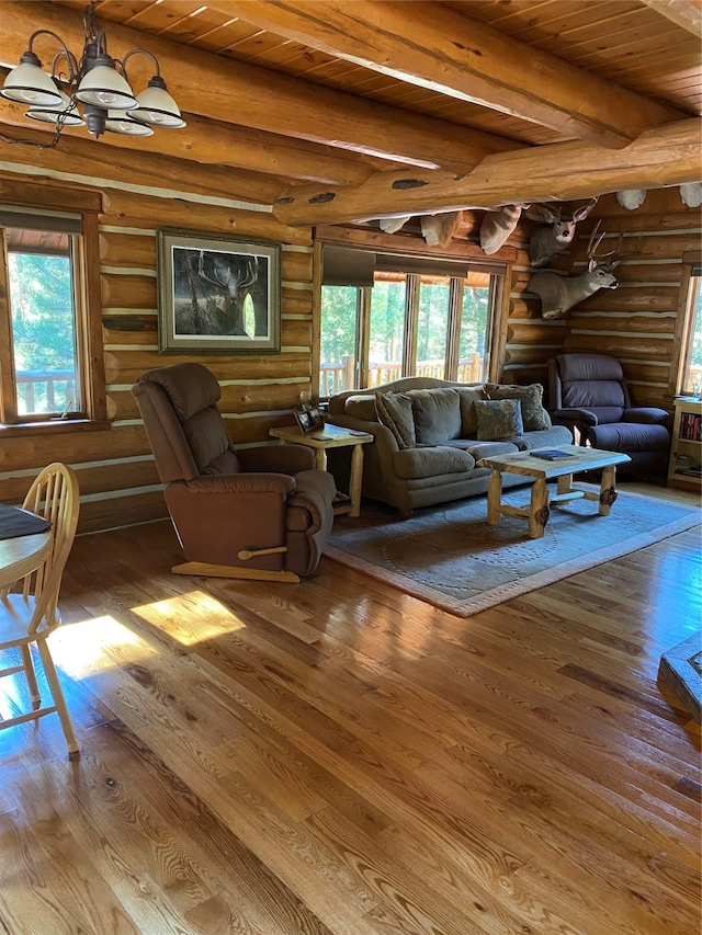 living room with beamed ceiling, hardwood / wood-style floors, log walls, and wood ceiling