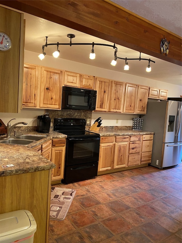 kitchen with decorative backsplash, sink, rail lighting, and black appliances