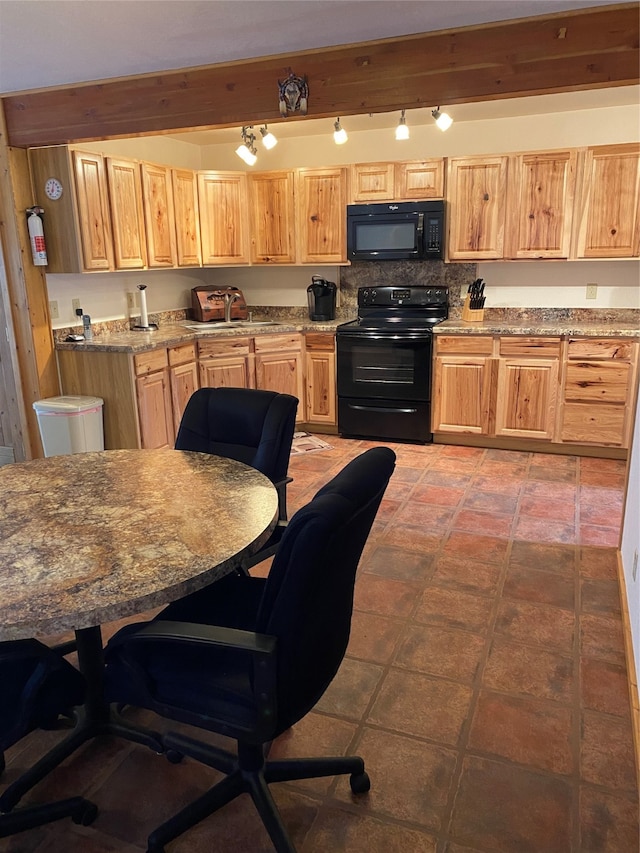 kitchen featuring beam ceiling, black appliances, decorative backsplash, and sink