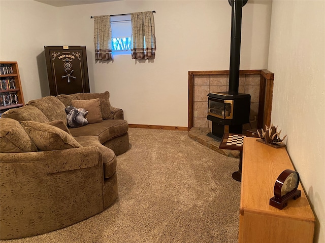 living room with a wood stove and carpet