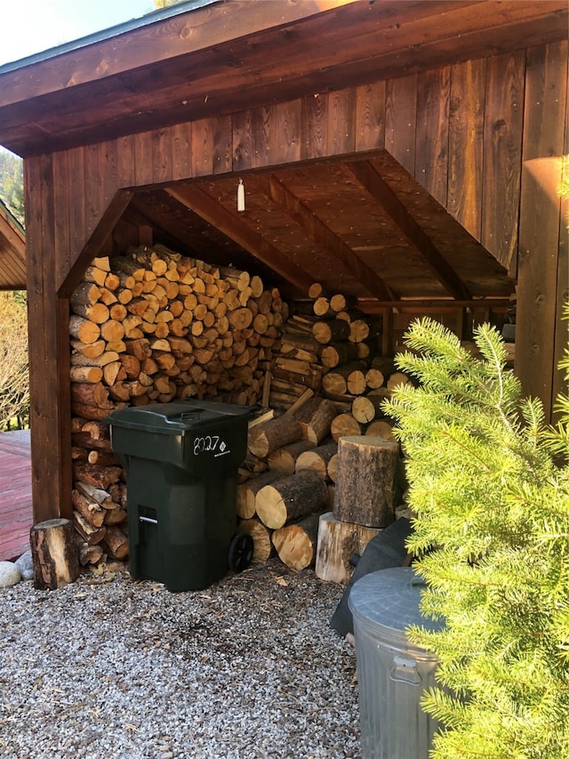 details featuring a wood stove and wood walls