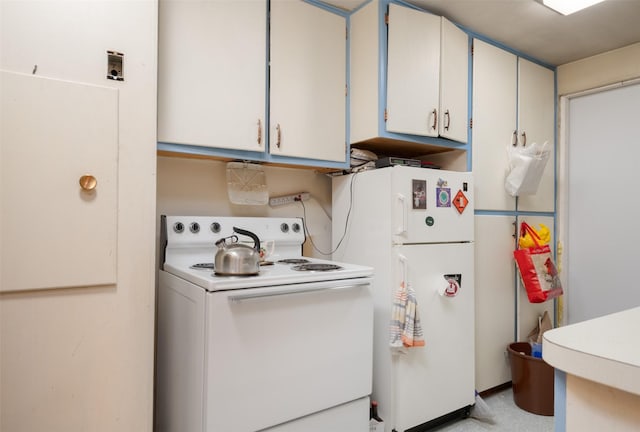 kitchen featuring white cabinetry and white appliances