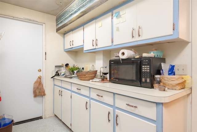 kitchen featuring white cabinetry