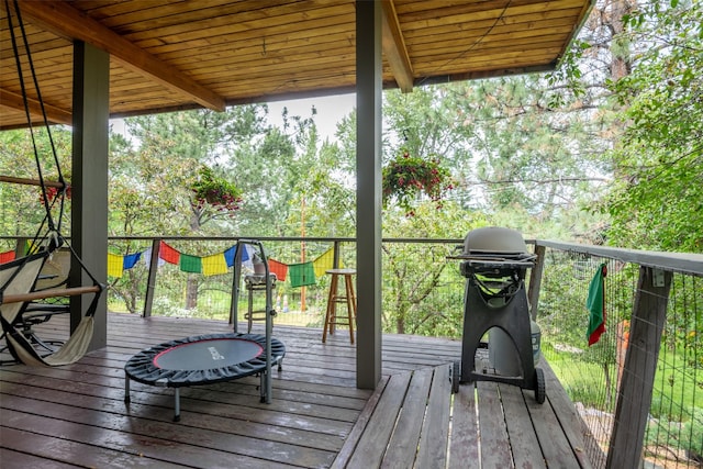 wooden deck featuring area for grilling