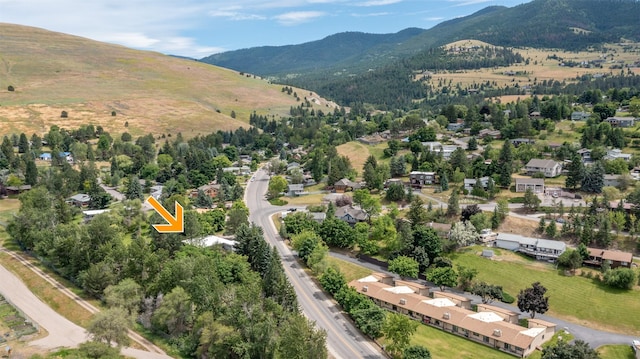 birds eye view of property with a mountain view