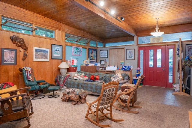 interior space featuring wood ceiling, beam ceiling, wooden walls, and rail lighting